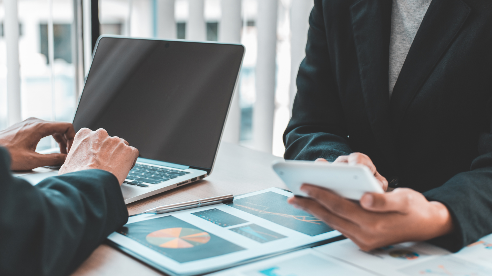 two people looking at financial data