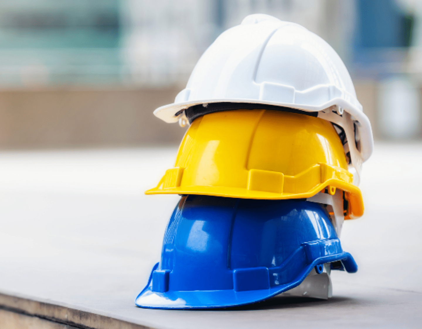 3 hard hats stacked on top of each other