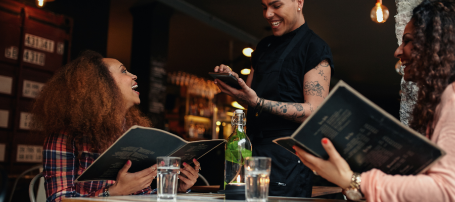 two people in a restaurant making an order